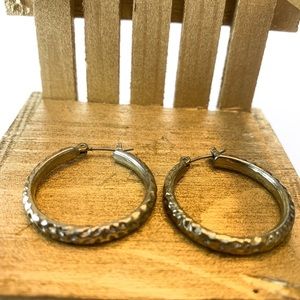 Sterling Silver hoop earrings.